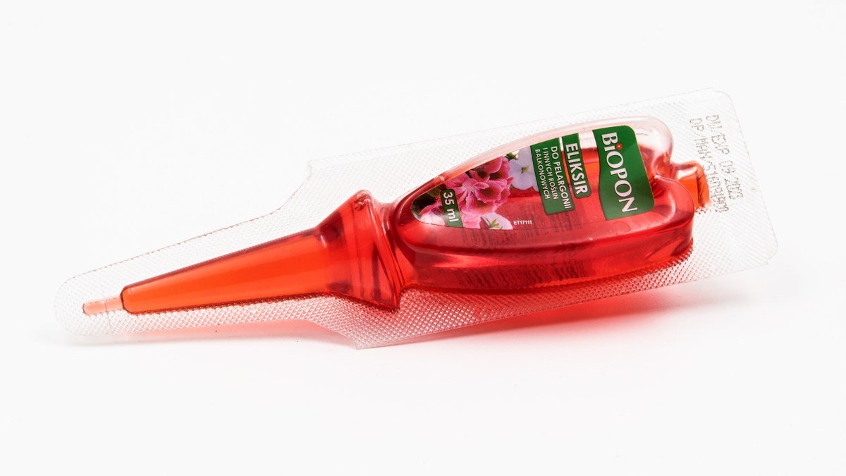 A real liquid flower fertilizer ampoule used as a generic houseplant feeding visual